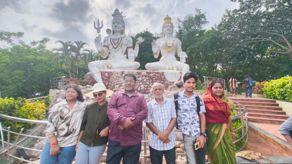 Large white statues of Lord Shiva and Goddess Parvati at Kailasagiri Hilltop in Visakhapatnam with scenic background