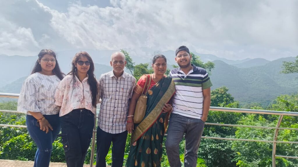 Scenic view of Araku Valley hills covered in greenery with blue sky in the background